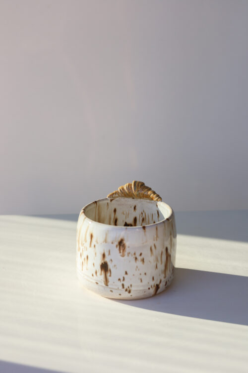 white brown speckles croissant cappuccino cup