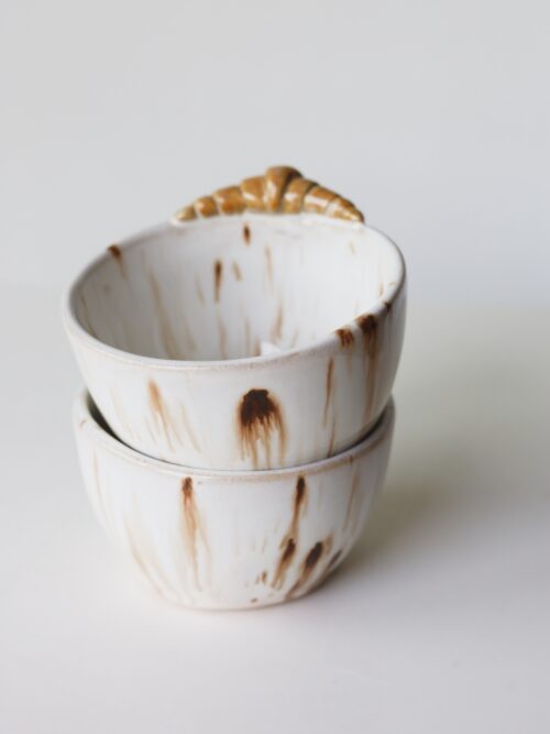 white speckled croissant coffee cup