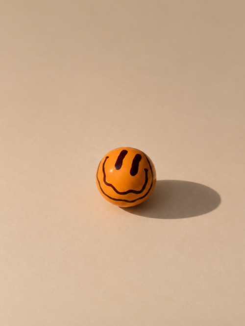 boule - orange brown drippy smiley