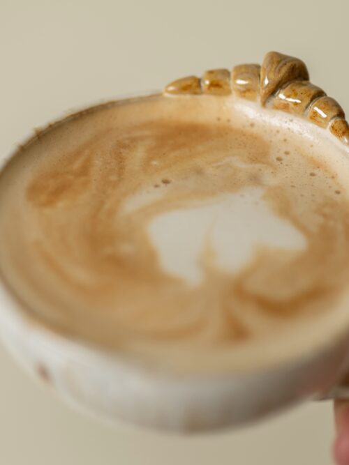 French speckled white croissant cappuccino cup